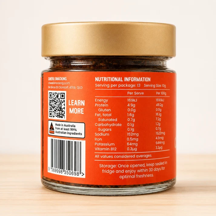 A glass jar of Cheeki Chilli Crunch Crunchy Biltong Bits premium Australian organic grass-fed beef biltong and transforms it into crunchy biltong bits unlocking versatility to step up flavour and protein with any meal ingredients.