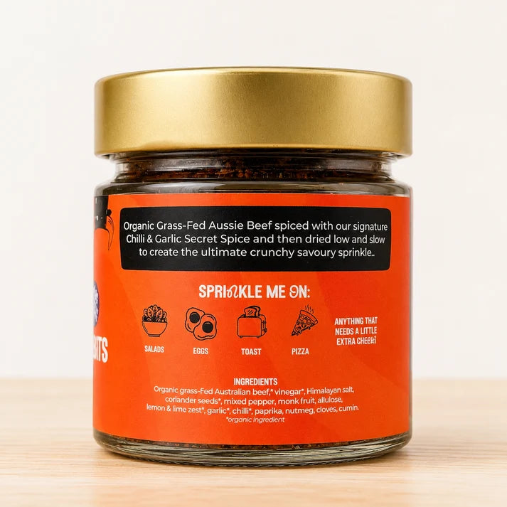 A glass jar of Cheeki Chilli Crunch Crunchy Biltong Bits premium Australian organic grass-fed beef biltong and transforms it into crunchy biltong bits unlocking versatility to step up flavour and protein with any meal how to